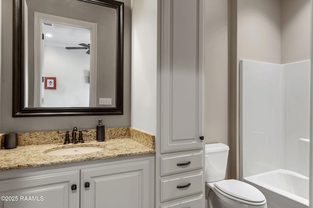 bathroom featuring toilet and vanity