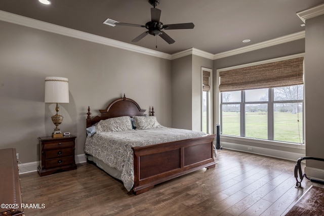 bedroom featuring dark wood-style floors, crown molding, baseboards, and a ceiling fan