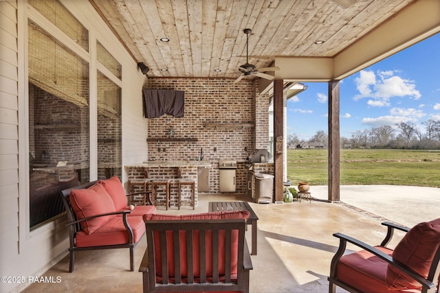 view of patio / terrace with an outdoor hangout area and a ceiling fan