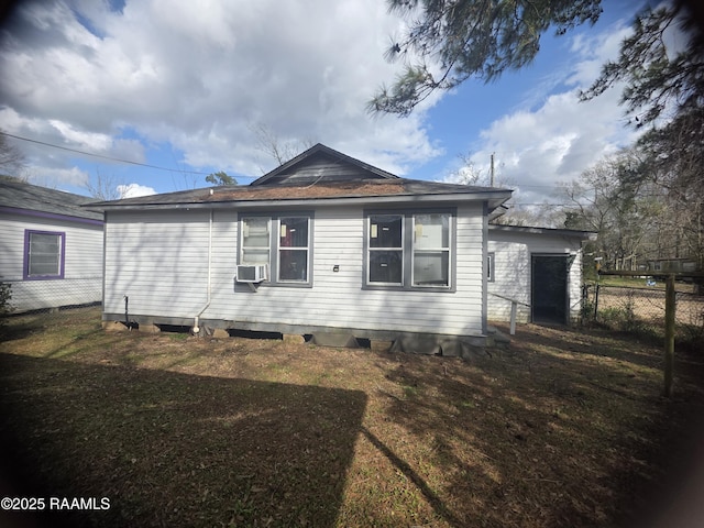 view of side of home with cooling unit, fence, and a lawn