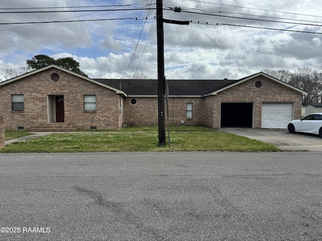 ranch-style home featuring brick siding, an attached garage, crawl space, driveway, and a front lawn