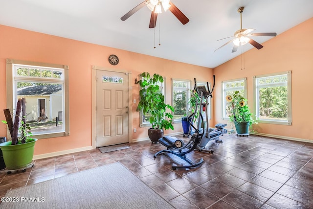 exercise area with a ceiling fan, vaulted ceiling, and baseboards