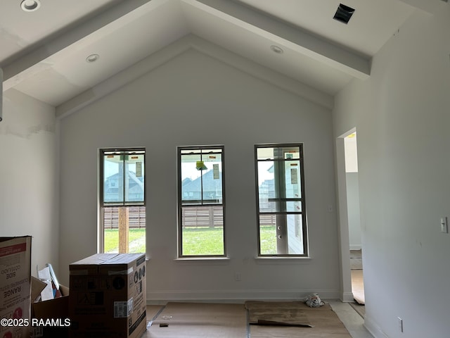 interior space featuring vaulted ceiling with beams, recessed lighting, and baseboards