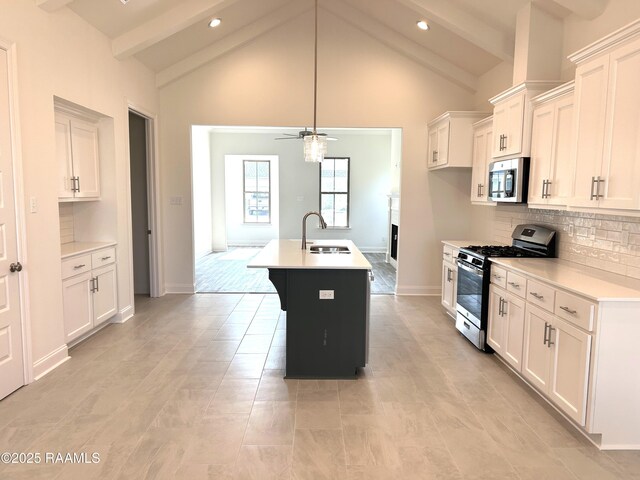 211 Bennington Ln, Youngsville, LA 70592 - kitchen with appliances with stainless steel finishes, a sink, a ceiling fan, light countertops, and beamed ceiling