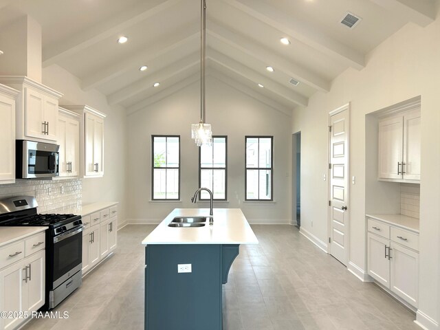 211 Bennington Ln, Youngsville, LA 70592 - kitchen featuring stainless steel appliances, a sink, backsplash, an island with sink, and recessed lighting