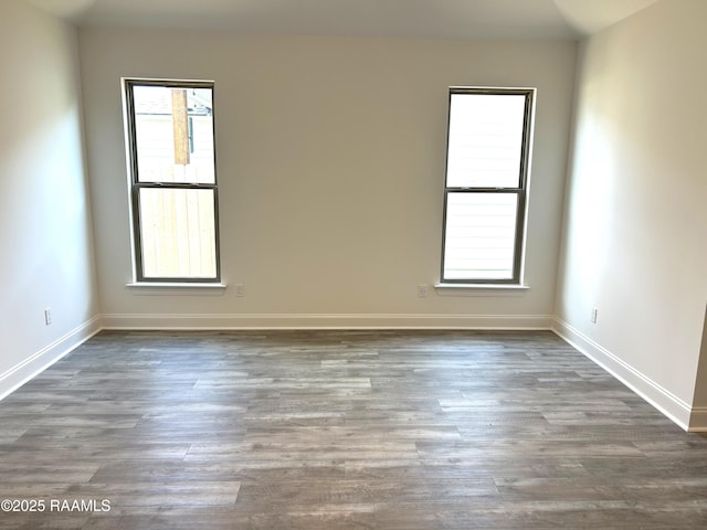 211 Bennington Ln, Youngsville, LA 70592 - unfurnished room with healthy amount of natural light, wood finished floors, and baseboards