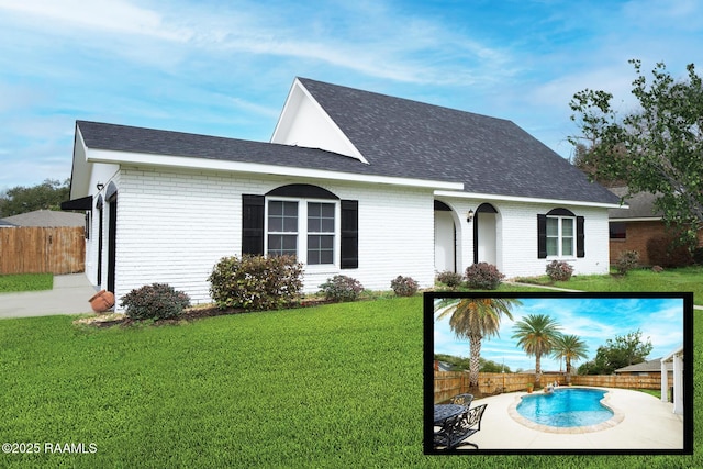 view of front facade featuring a fenced in pool, a front yard, brick siding, and a fenced backyard