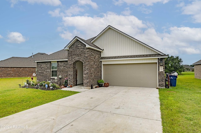 view of front facade with a garage, brick siding, concrete driveway, and a front yard