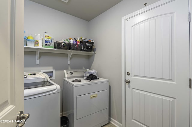 washroom featuring laundry area and washing machine and clothes dryer