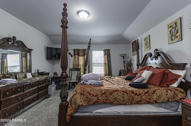 carpeted bedroom featuring vaulted ceiling