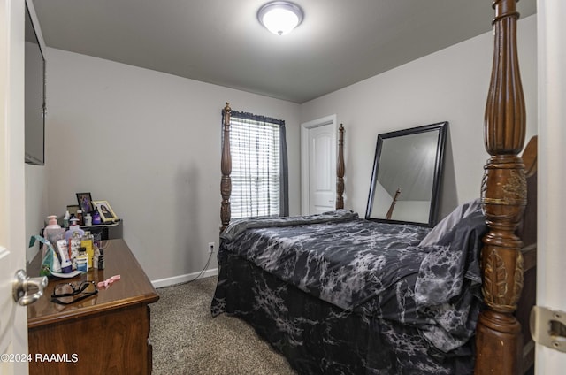 bedroom featuring carpet and baseboards