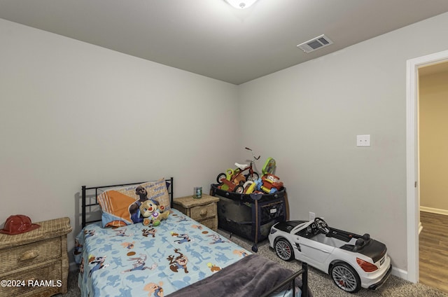 bedroom with visible vents and baseboards