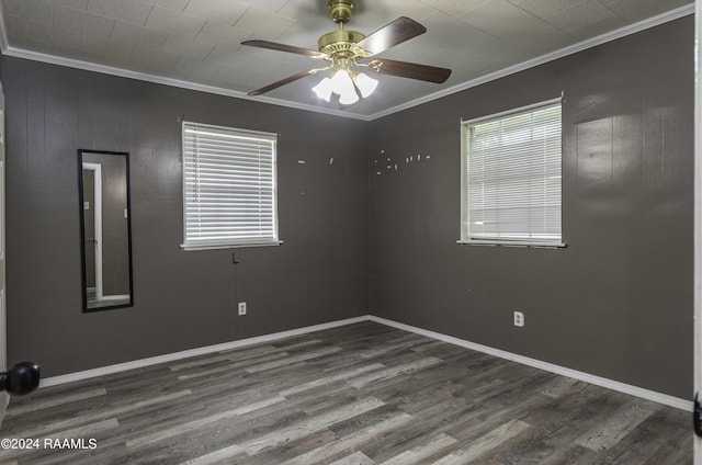 empty room with baseboards, wood finished floors, a ceiling fan, and ornamental molding