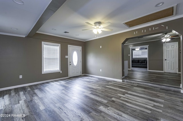 entryway with a ceiling fan, crown molding, baseboards, and wood finished floors