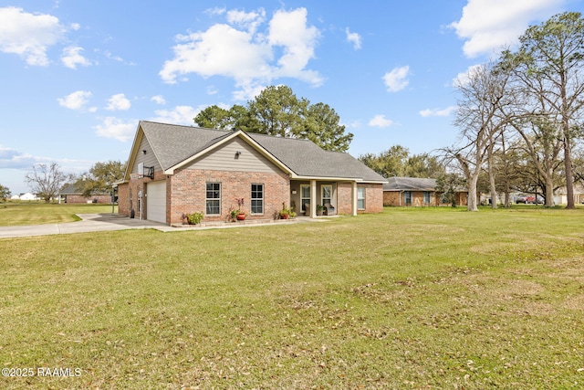 view of front facade featuring driveway, brick siding, and a front lawn