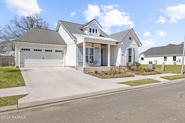 modern farmhouse with a porch, board and batten siding, concrete driveway, an attached garage, and a shingled roof