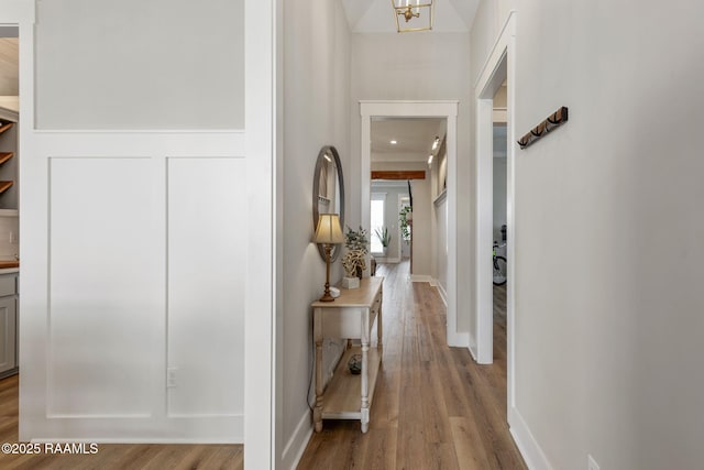 corridor featuring wood finished floors