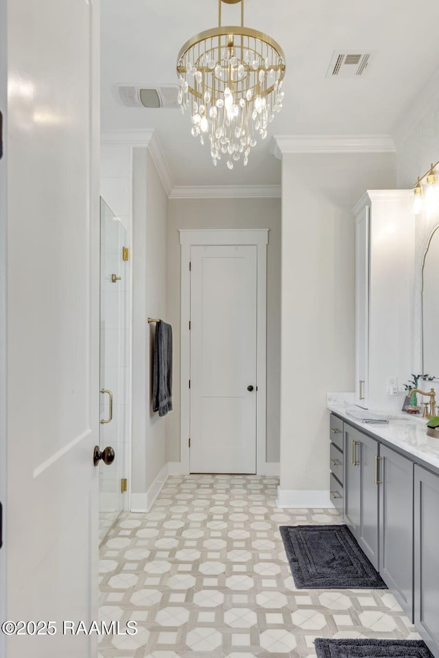 bathroom featuring vanity, a stall shower, visible vents, and ornamental molding