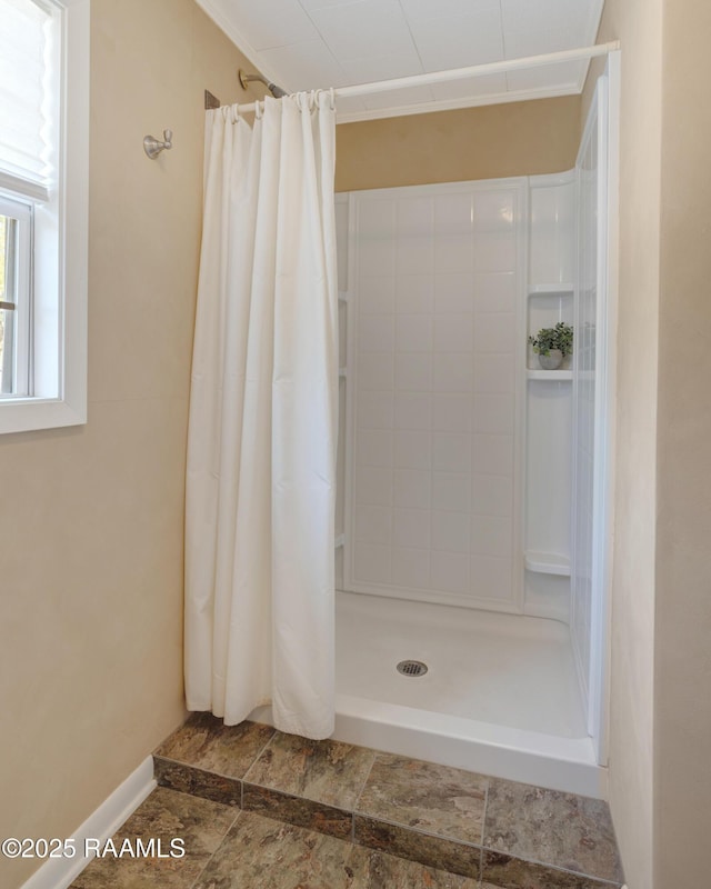 bathroom with a tile shower