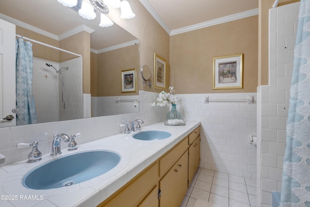 bathroom with tile patterned floors, crown molding, tile walls, and a sink