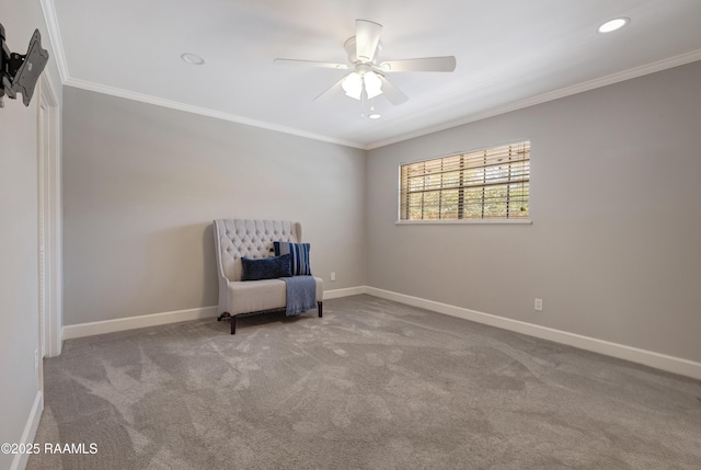 unfurnished room featuring crown molding, carpet flooring, and baseboards