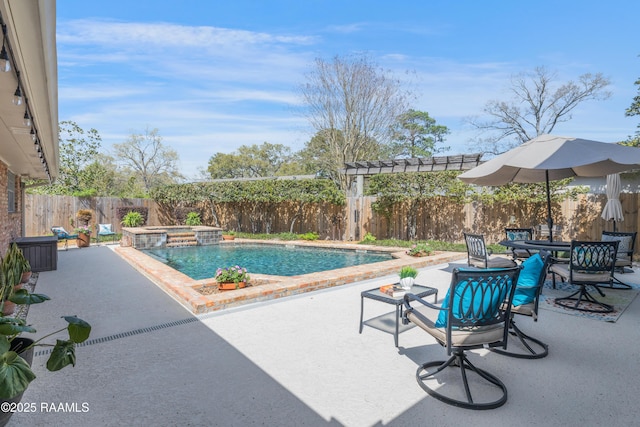 view of swimming pool with a patio area, an in ground hot tub, outdoor dining area, and a fenced backyard