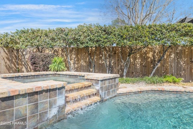 view of swimming pool with a fenced backyard