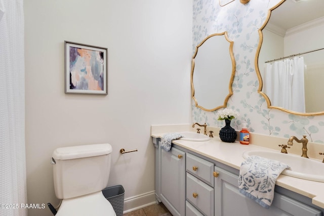 bathroom featuring a sink, toilet, ornamental molding, and tile patterned flooring