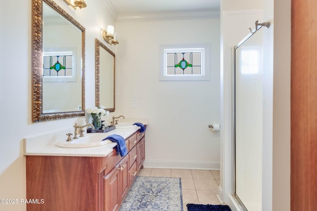 bathroom featuring tile patterned floors, a stall shower, crown molding, and a sink