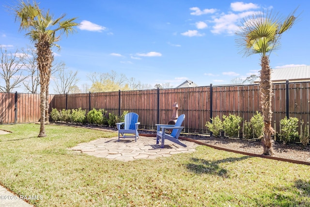 view of yard featuring a patio area and a fenced backyard