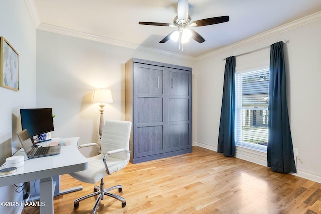 home office featuring baseboards, light wood-style floors, ceiling fan, and crown molding