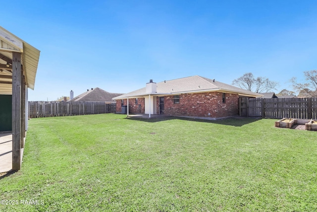 view of yard with a fenced backyard