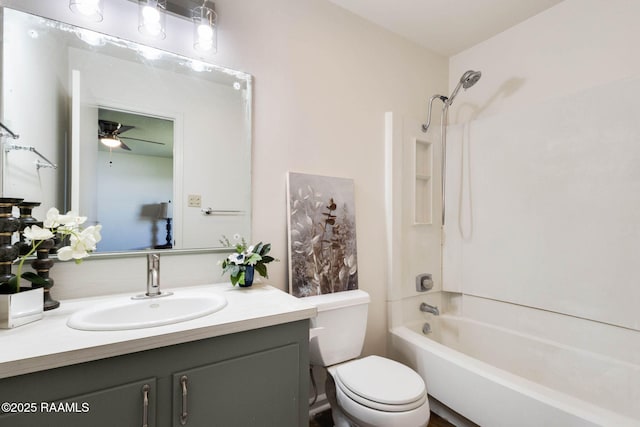 bathroom with vanity,  shower combination, and toilet