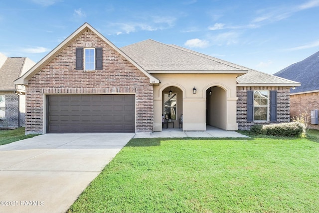 view of front of home with a shingled roof, concrete driveway, an attached garage, a front yard, and brick siding