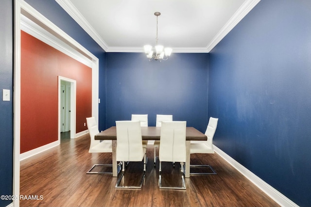 dining area featuring crown molding, wood finished floors, baseboards, and a chandelier