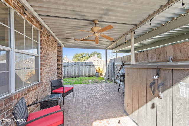 view of patio / terrace with a fenced backyard and a ceiling fan