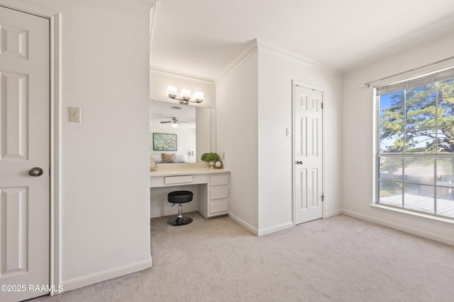 bathroom with a wealth of natural light, baseboards, and ornamental molding