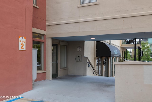 doorway to property with stucco siding