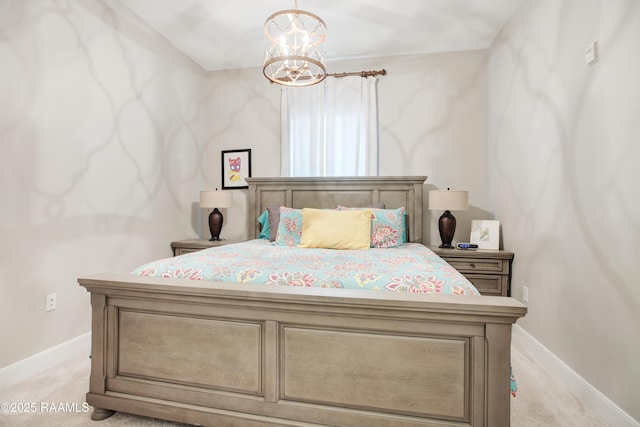 bedroom with a notable chandelier, light colored carpet, and baseboards