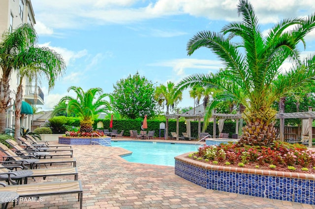 community pool featuring a patio area and a pergola