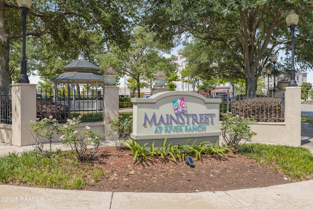 community sign with fence