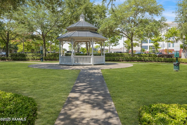 view of property's community with a gazebo and a yard