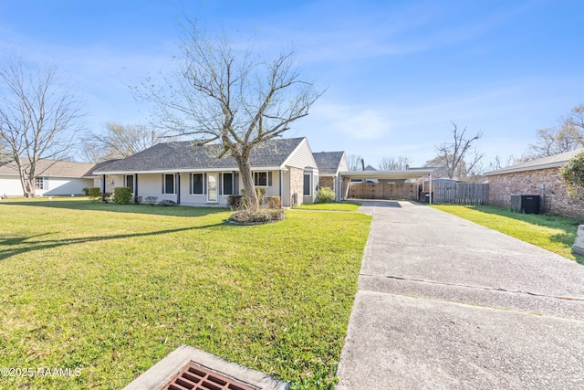 ranch-style home featuring brick siding, a front lawn, fence, central AC, and driveway