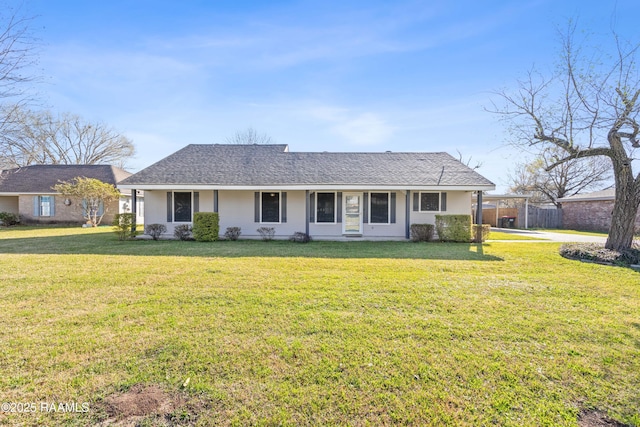 single story home with roof with shingles, a front yard, and fence