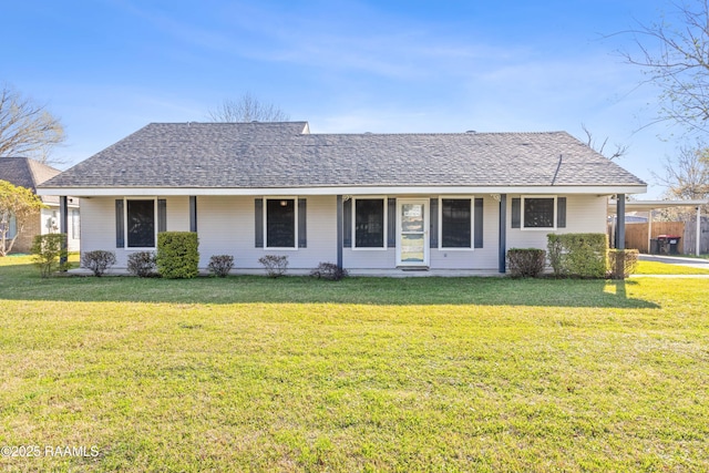 single story home featuring a front yard and a shingled roof