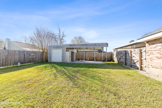 view of yard with a patio area, a storage shed, a fenced backyard, an outbuilding, and a gate