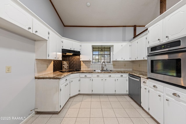 kitchen with decorative backsplash, ornamental molding, appliances with stainless steel finishes, and a sink