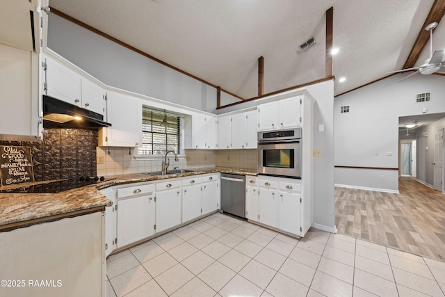 kitchen featuring visible vents, a sink, under cabinet range hood, appliances with stainless steel finishes, and backsplash