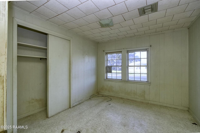 unfurnished bedroom featuring visible vents and a closet