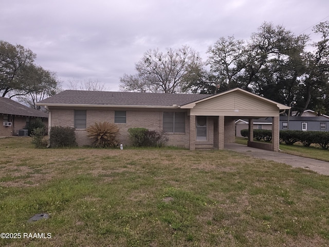 619 Evangeline St, Ville Platte, LA 70586 - ranch-style house with an attached carport, a front yard, cooling unit, driveway, and brick siding
